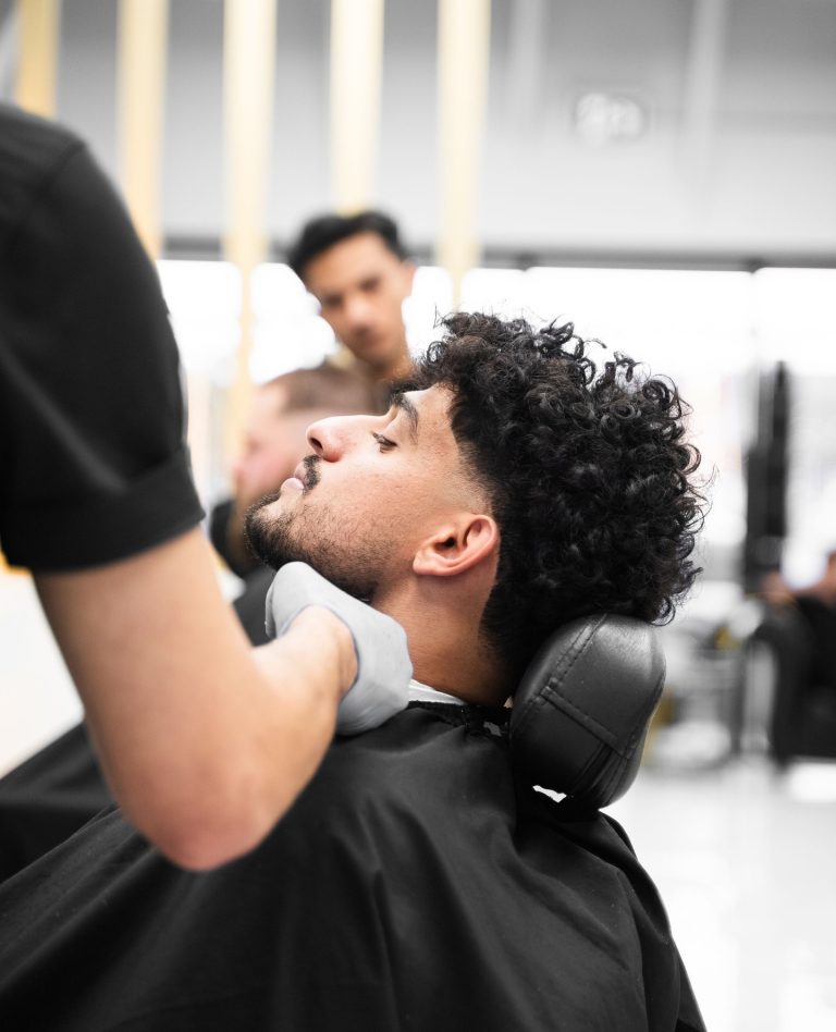 Barber performing precise beard trim and neckline cleanup in Vaughan